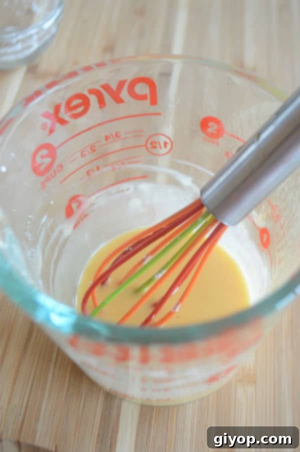 Sun-Dried Apricot Qamar Al-Deen Pudding 6 A glass mixture cup with pudding inside