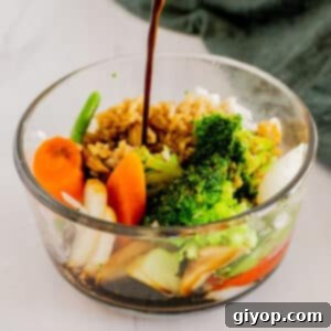 A close up image of a bowl of vegetables with stir fry sauce.