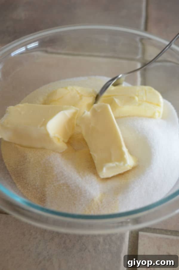 Pistachio-Packed Maamoul with Velvety Ashta 5 A deep bowl containing a mixture of flours, sugar, butter, and yeast, ready for the initial mixing of the semolina dough.