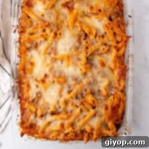 An overhead image of a glass casserole with pasta bake.