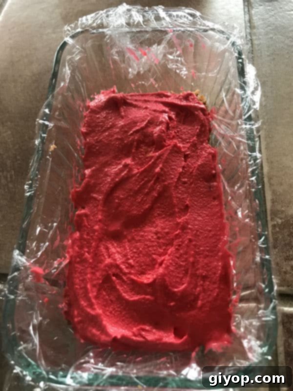 Tricolor Ice Cream Knafeh Delight 8 A mixture of knafeh in red, ready for layering, in a glass pan