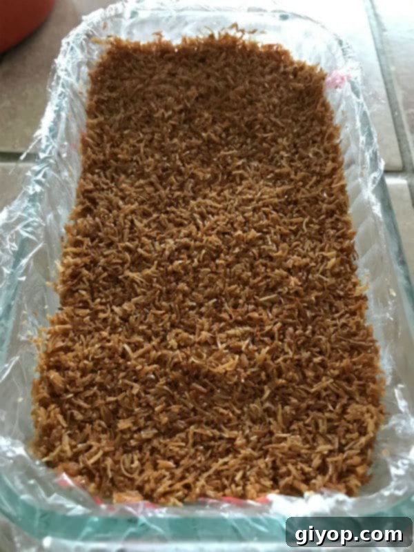 Tricolor Ice Cream Knafeh Delight 9 A mixture of knafeh and white ice cream in a glass pan