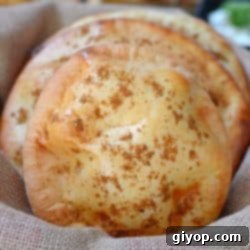 Khameer flat bread stacked on a burlap fabric