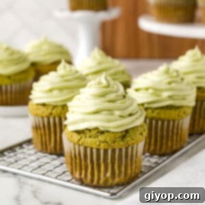Matcha cupcakes on a cooling rack.