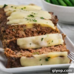 A close up image of thick, juicy slices of meatloaf.