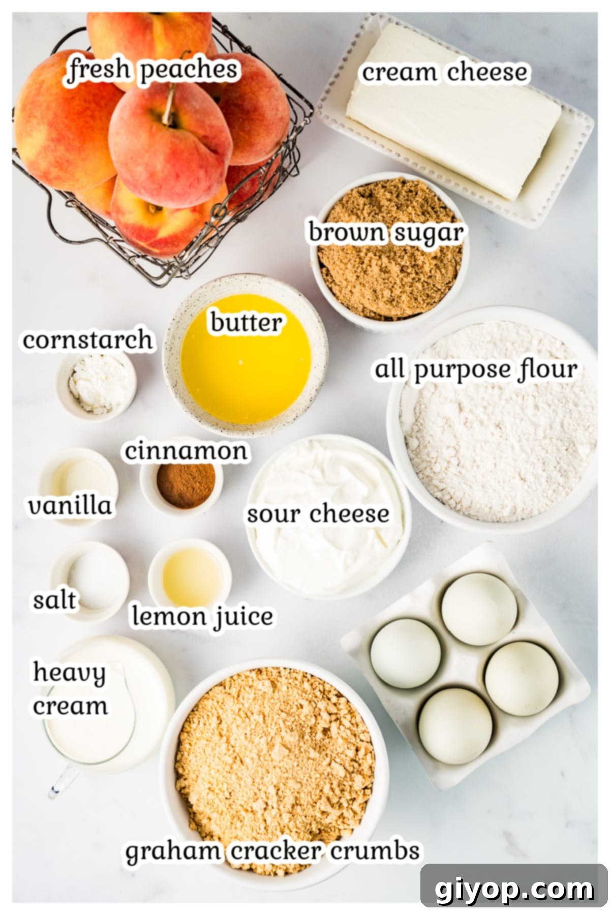 Assorted ingredients laid out on a table, ready for baking Peach Cobbler Cheesecake.