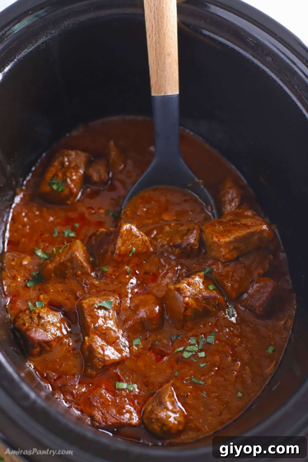 A bowl of slow cooker beef and noodles ready to be served, highlighting the comforting appeal of the dish.
