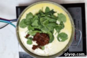 Fresh baby spinach and chopped sun-dried tomatoes added to the creamy orzo sauce.