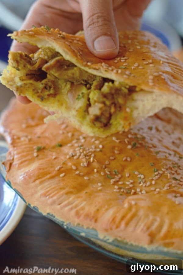 A freshly baked chicken shawarma pie, golden and inviting.