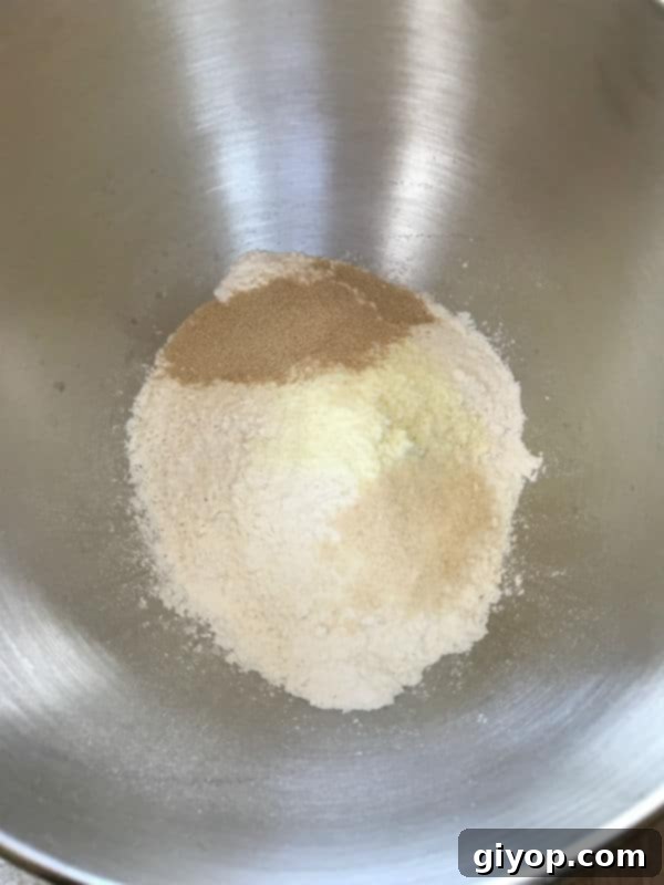 Dough ingredients being mixed in a bowl.
