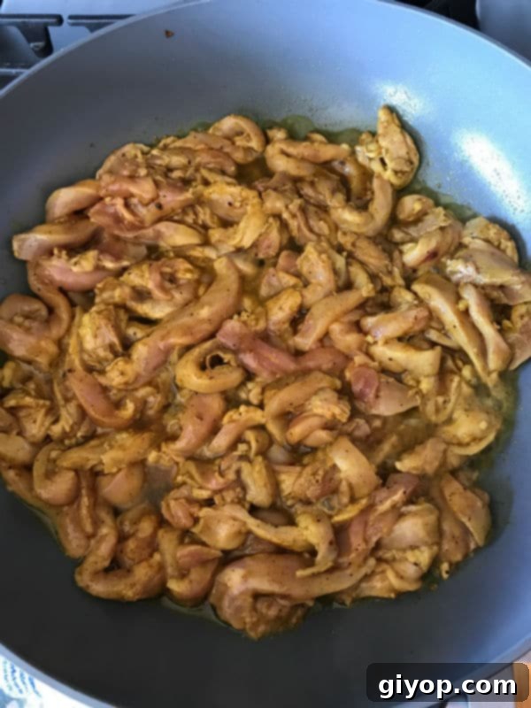 Cooked chicken shawarma in a skillet.