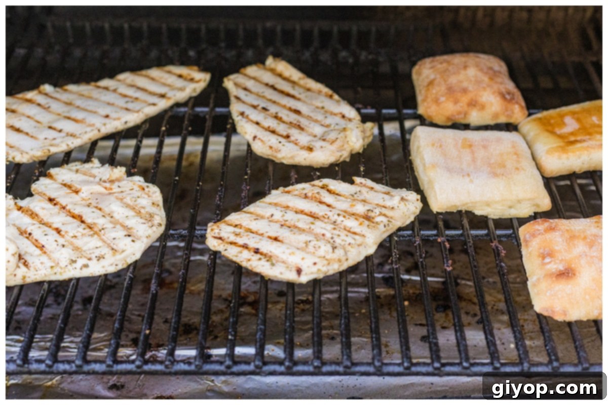 Sun-Kissed Caprese Chicken Sandwich 9 Grilling chicken and bread simultaneously on an outdoor grill.