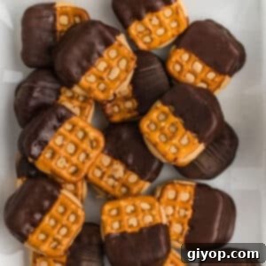 An overhead image of pretzel bites on a white plate.