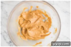 creamed peanut butter and butter in a glass bowl.