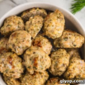 A white bowl with chicken meatballs.