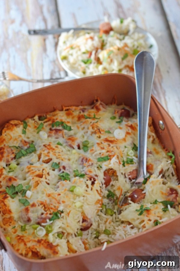 A large pot of Cheesy Chicken and Rice Casserole, steaming hot and ready to be served, emphasizing its comforting nature.