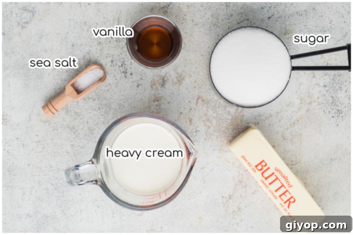 Ingredients for the caramel sauce laid out on a countertop: butter, sugar, cream, vanilla, and sea salt.