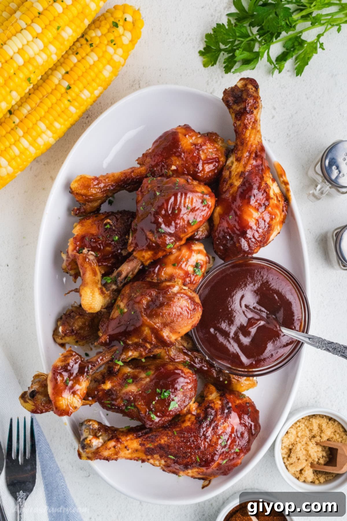 Juicy, smoky-sweet slow cooker chicken drumsticks ready to serve on a platter.