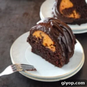 A piece of chocolate pumpkin cake on a small dessert plate.