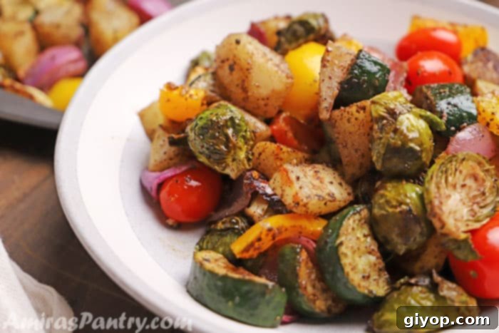 Sun-Kissed Mediterranean Roasted Vegetables 5 A serving of Sumac roasted vegetables, beautifully plated on a pristine white dish, ready to be enjoyed.