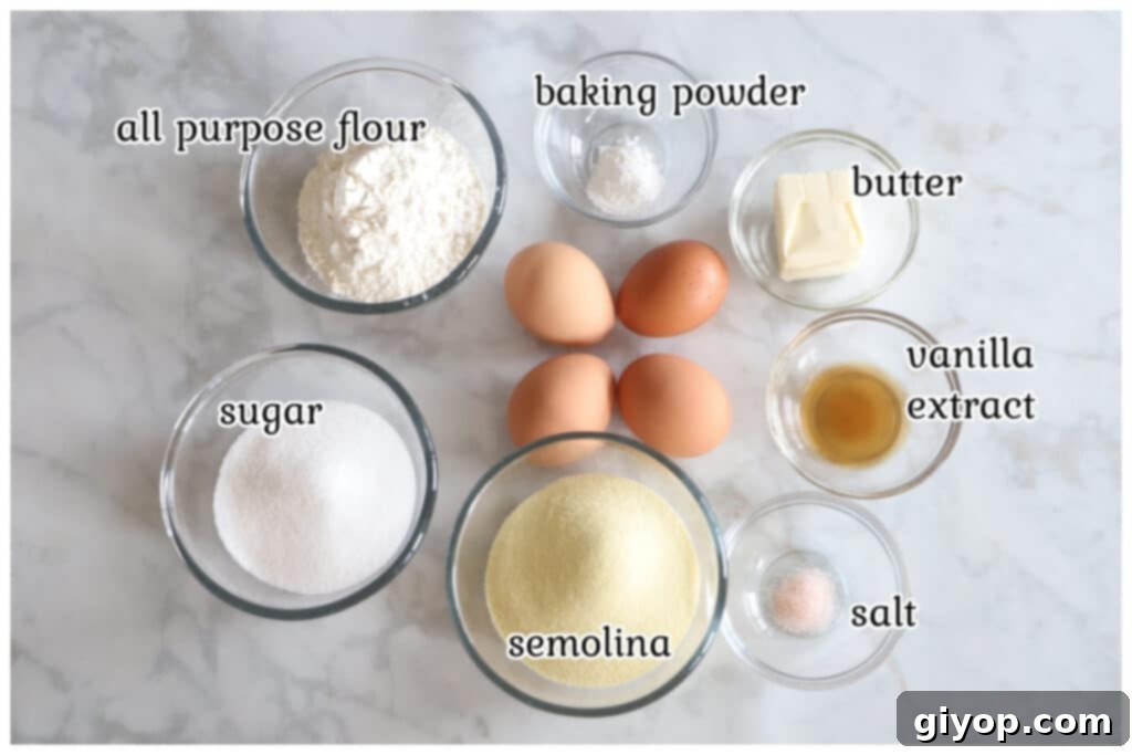 Syrup-Soaked Semolina Revani Cake 3 Ingredients for the revani cake laid out on a marble surface, including eggs, sugar, butter, semolina, and flour.