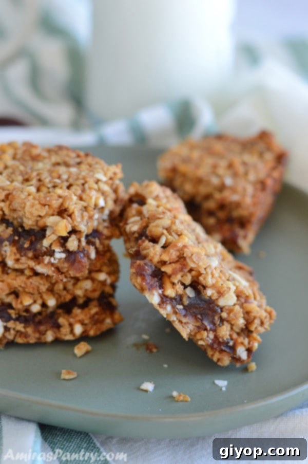 Breakfast squares stacked neatly on top of each other on a plate, highlighting their appetizing appearance.