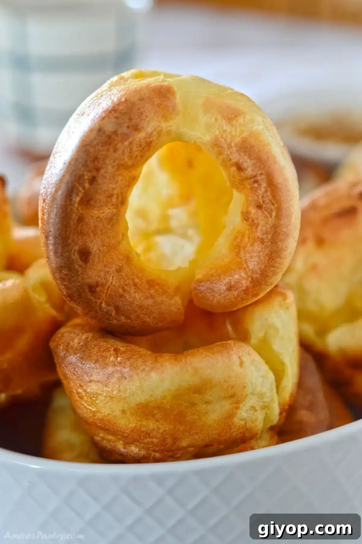 A stack of Yorkshire pudding showing a hollow one on top.