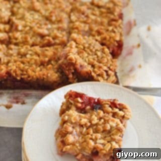 Strawberry Rhubarb Crumble Bliss 10 A plate with crumbled rhubarb bars