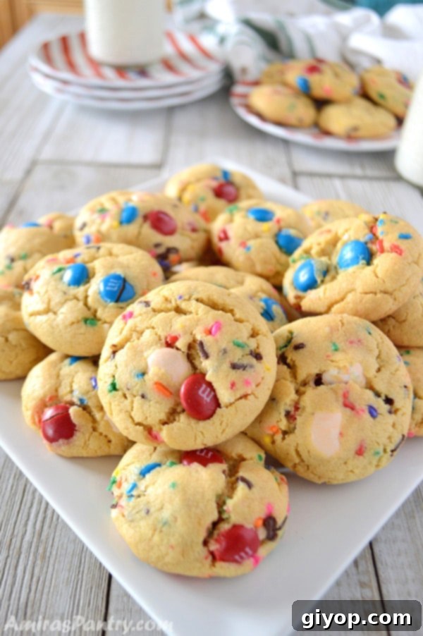 Pudding Burst Cookies 2 A close up of cookies made with M&M on a plate, ready to be enjoyed.