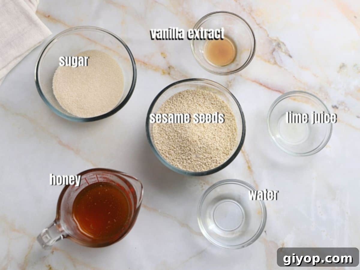 Various essential ingredients for crafting sesame candy bars laid out on a clean surface, prominently featuring sesame seeds, golden honey, granulated sugar, and fresh lime.