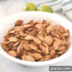 Blazing Pumpkin Seed Crunch 3 A close up look at a white plate with spicy roasted pumpkin seeds.