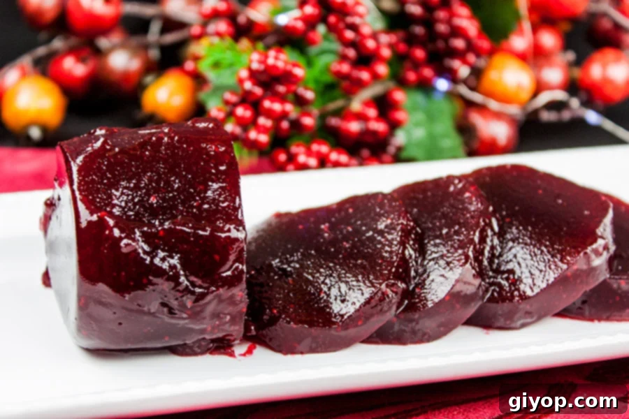 Perfectly sliced jellied cranberry sauce on a serving platter, ready for holiday dining.