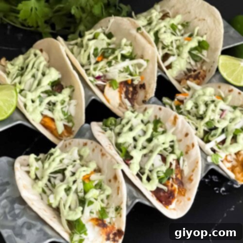 Fiery Blackened Fish Tacos 15 Blackened Fish Tacos on a dark background, a close-up shot.