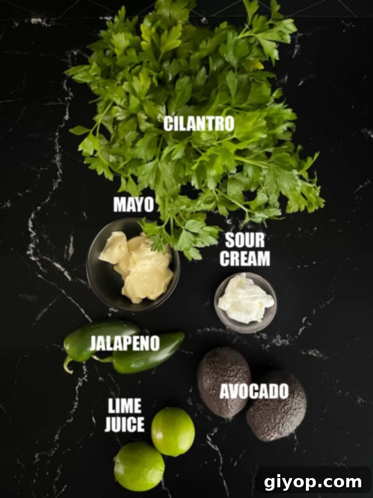 Fiery Blackened Fish Tacos 5 Ingredients for a creamy avocado jalapeno sauce, including avocado, sour cream, and cilantro.