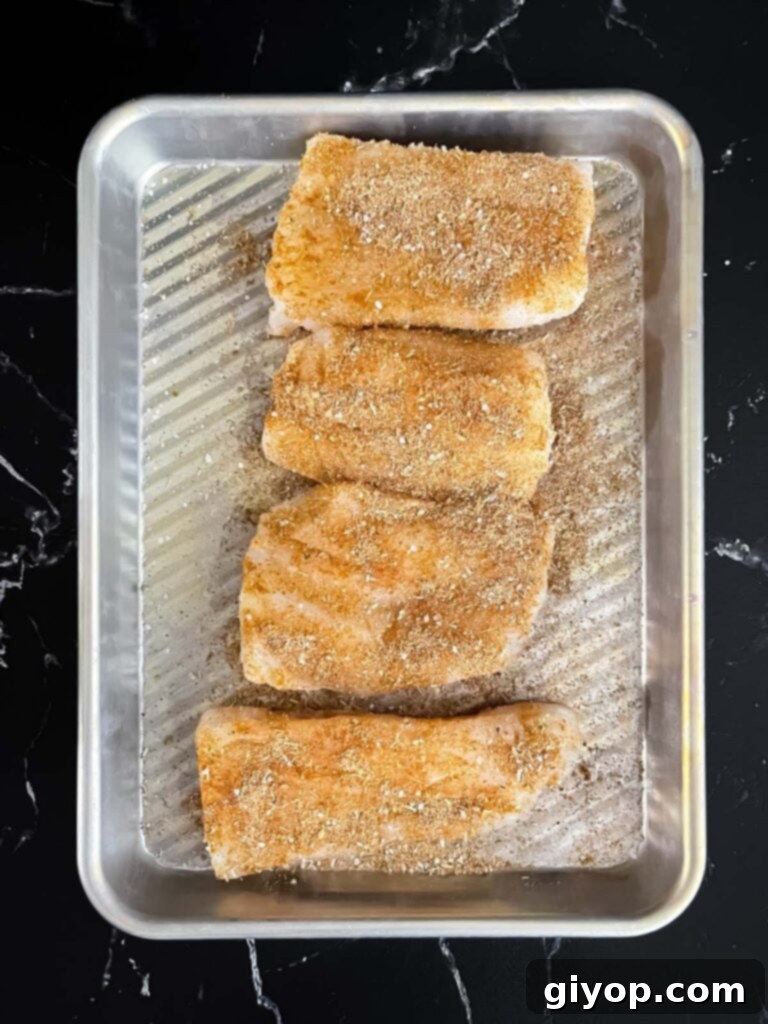 Fiery Blackened Fish Tacos 9 Seasoned fish fillets on a small prep pan.