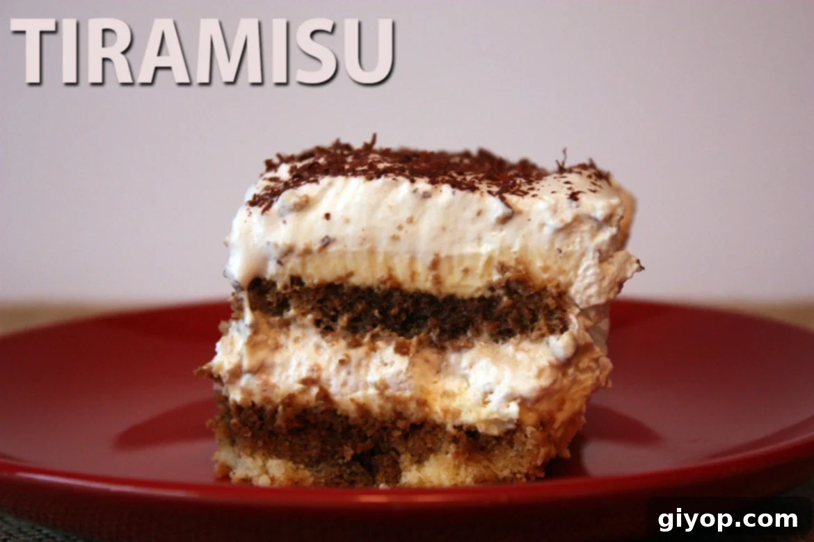 Effortless Tiramisu No Ladyfingers 11 A slice of tiramisu on a red plate, showcasing layers.