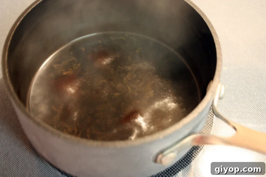 Effortless Tiramisu No Ladyfingers 6 Espresso and sugar mixture simmering in a small saucepan, reducing to a concentrated syrup for Tiramisu.