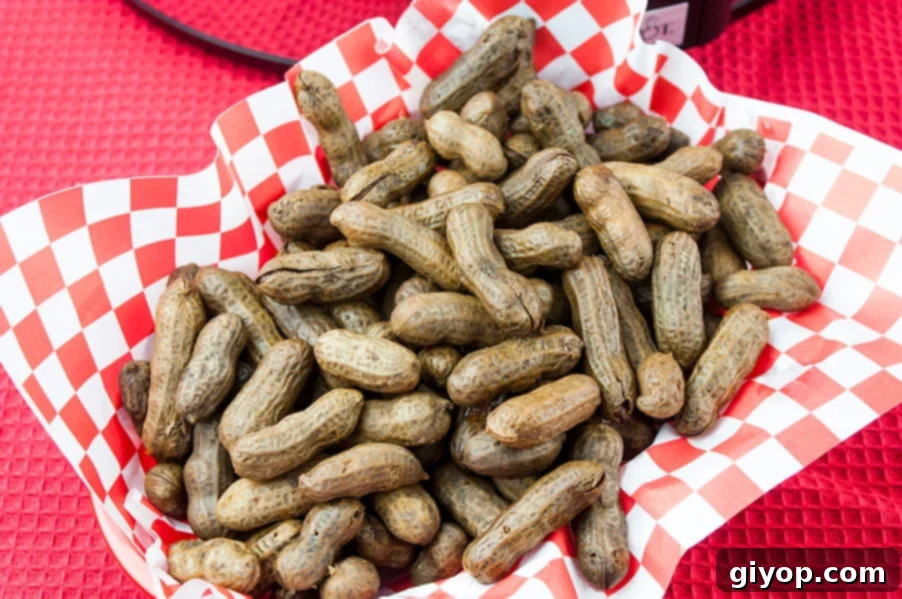 Easy Slow Cooker Boiled Peanuts 2 A rustic red basket brimming with freshly made slow cooker boiled peanuts, steam gently rising.