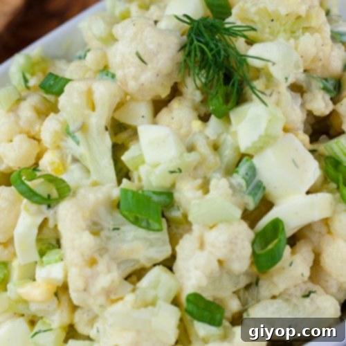 Clever Cauliflower Potato Salad 3 Cauliflower Mock Potato Salad in a white serving dish.
