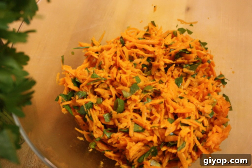 Savory Carrot Salad on a cutting board, ready to be served.