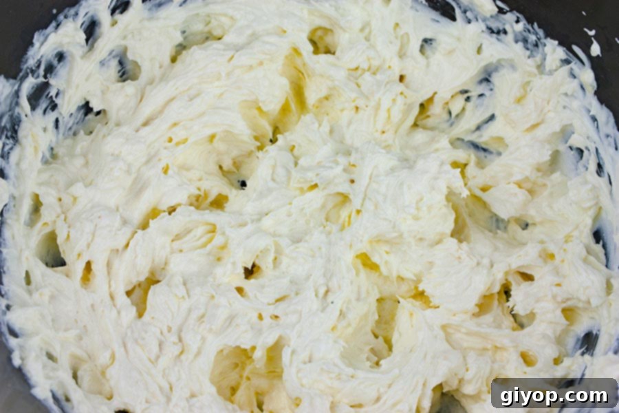 Whip Up The Best Buffalo Chicken Dip 4 Buffalo Chicken Dip - cream cheese mixture in a mixing bowl