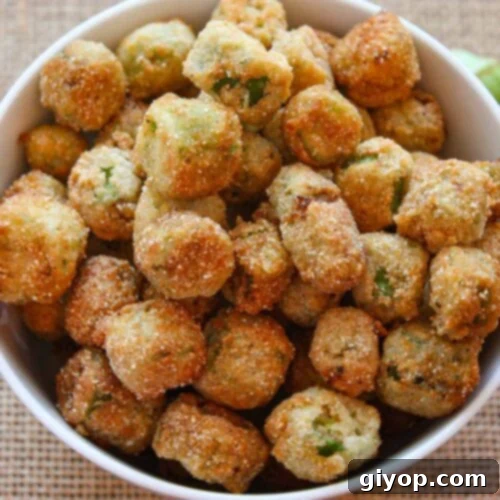 Fried okra in a white bowl, representing the final dish of buttermilk fried okra.