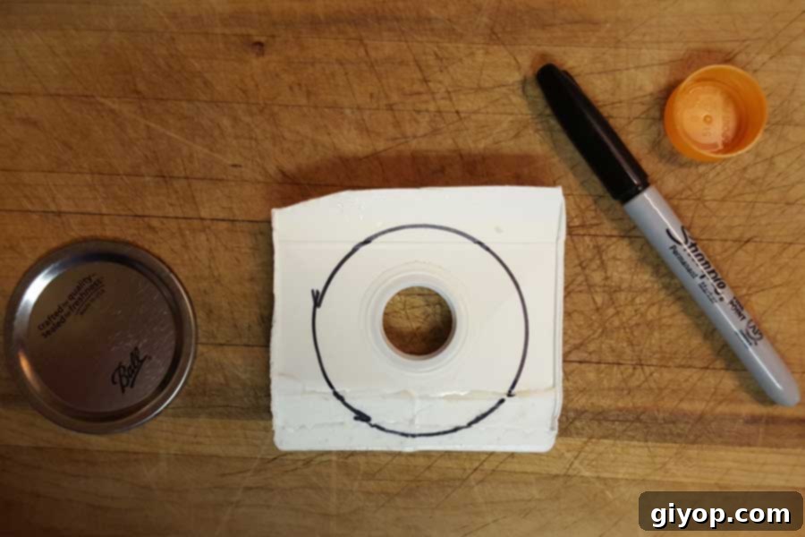 Lid cut off of orange juice carton.