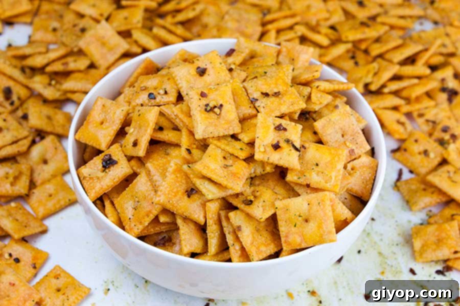 Another close-up shot of the finished Firecracker Cheez-Itz in a white bowl, highlighting their delicious seasoning.