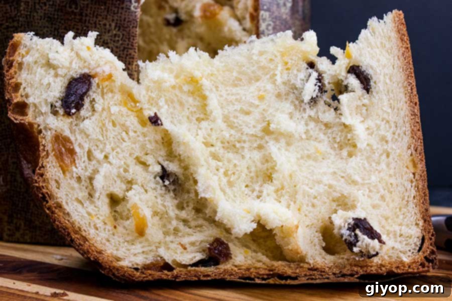 Panettone on a wooden cutting board, ready to be sliced.