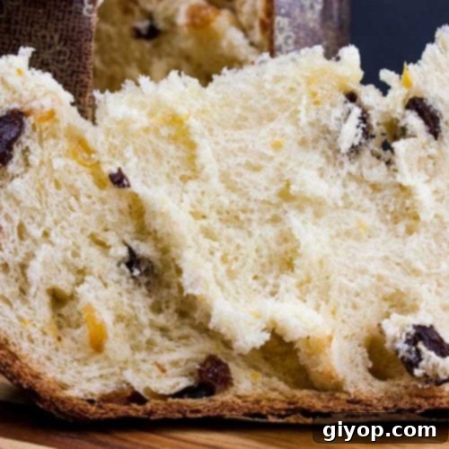 Panettone on a wooden cutting board.