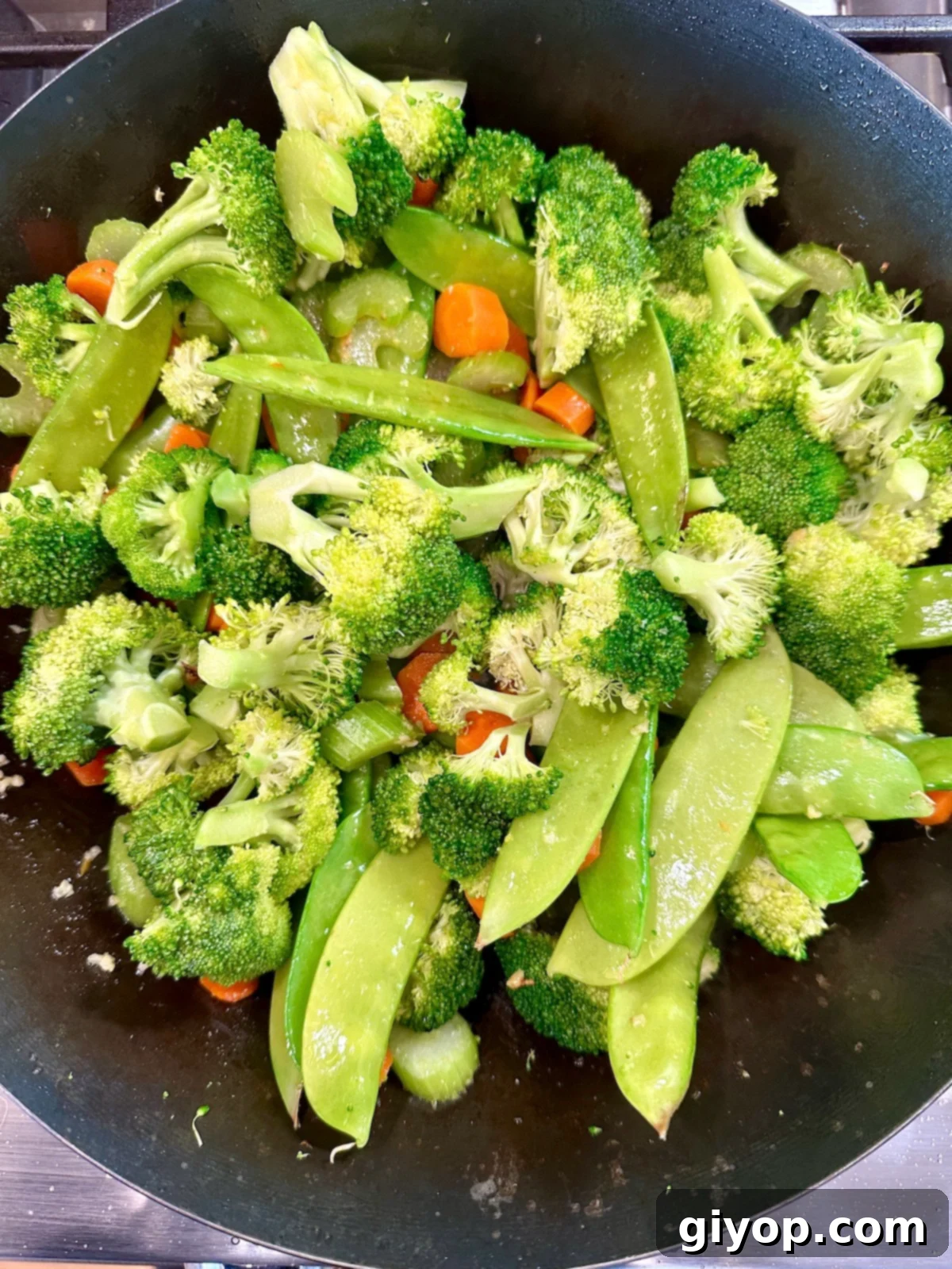 Cooked vegetables in a pan.