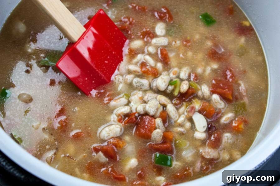 A snapshot of bacon, onions, and jalapeños sizzling in the Ninja Foodi pot, showcasing the first step of building the flavor base for the Charro Beans.