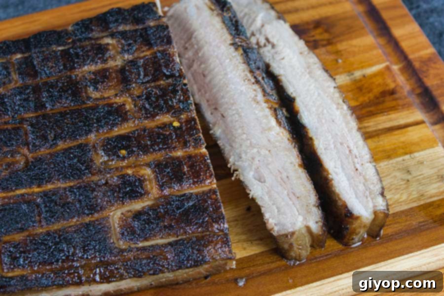 Step up your grill game by serving up some deliciously rendered down smoked pork belly. It's so rich and decadent, everybody will rave!