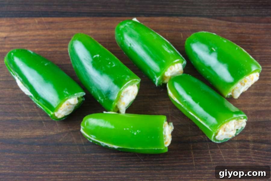 Smoky Keto Armadillo Eggs 4 jalapenos stuffed with cheese mixture